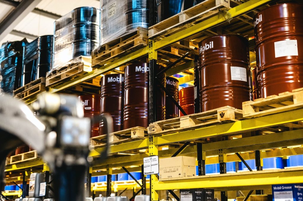Welcome to Oil Store! 29 oil drums on shelves in warehouse